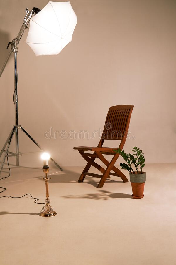 studio-setup-photoshoot-props-chair-plant-strobe-light-lamp-179826726